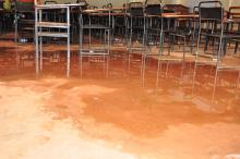 one of the lecture rooms in  the closed UCB with stagnant water from the leakages.