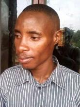 Alex Mujuni, a resident who was attacked and robbed of 800,000/=